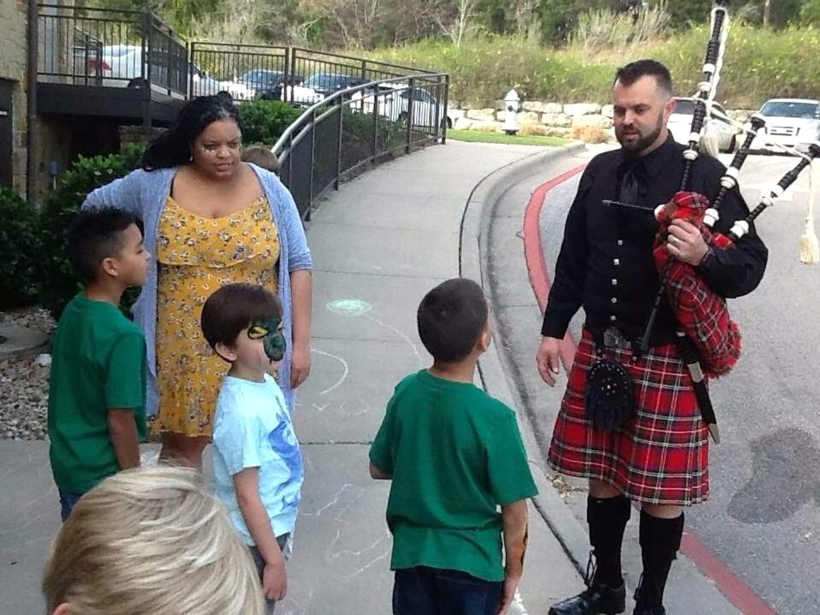 Ryan Guthrie introducing the pipes to children in Austin